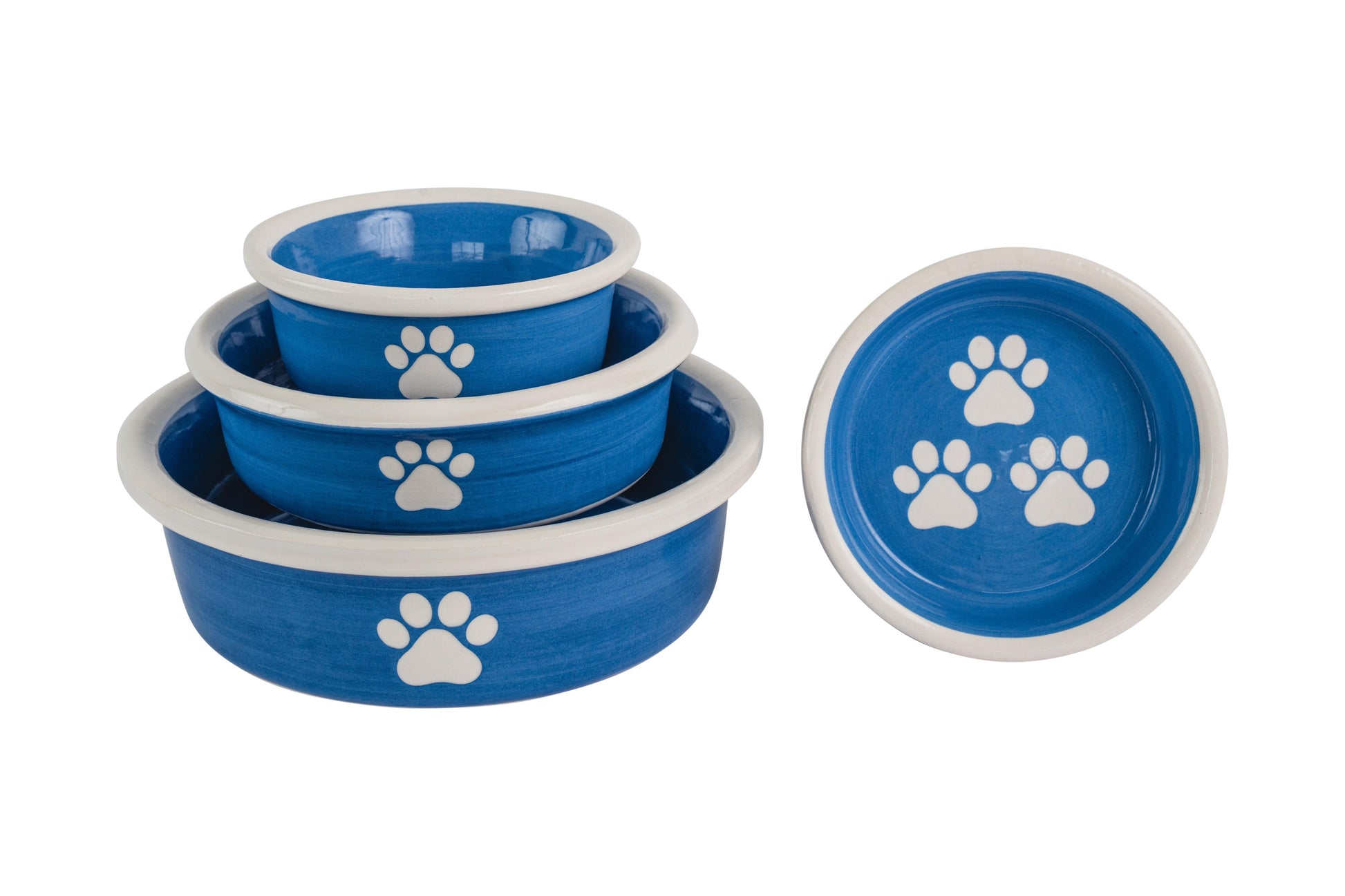 Set of blue handmade ceramic pet bowls with white paw prints in multiple sizes.
