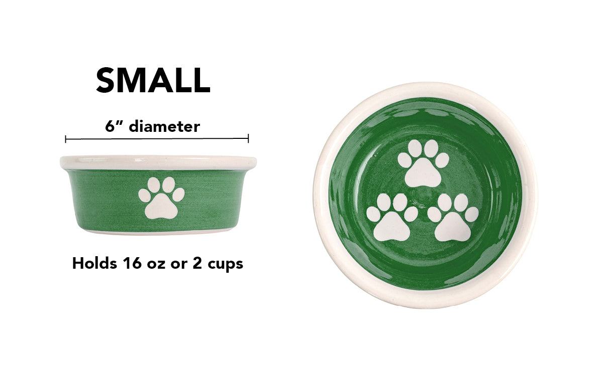 Small green handmade ceramic dog bowl with white paw prints, 6-inch diameter and 2-cup (16-ounce) capacity.