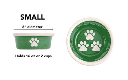 Small green handmade ceramic dog bowl with white paw prints, 6-inch diameter and 2-cup (16-ounce) capacity.