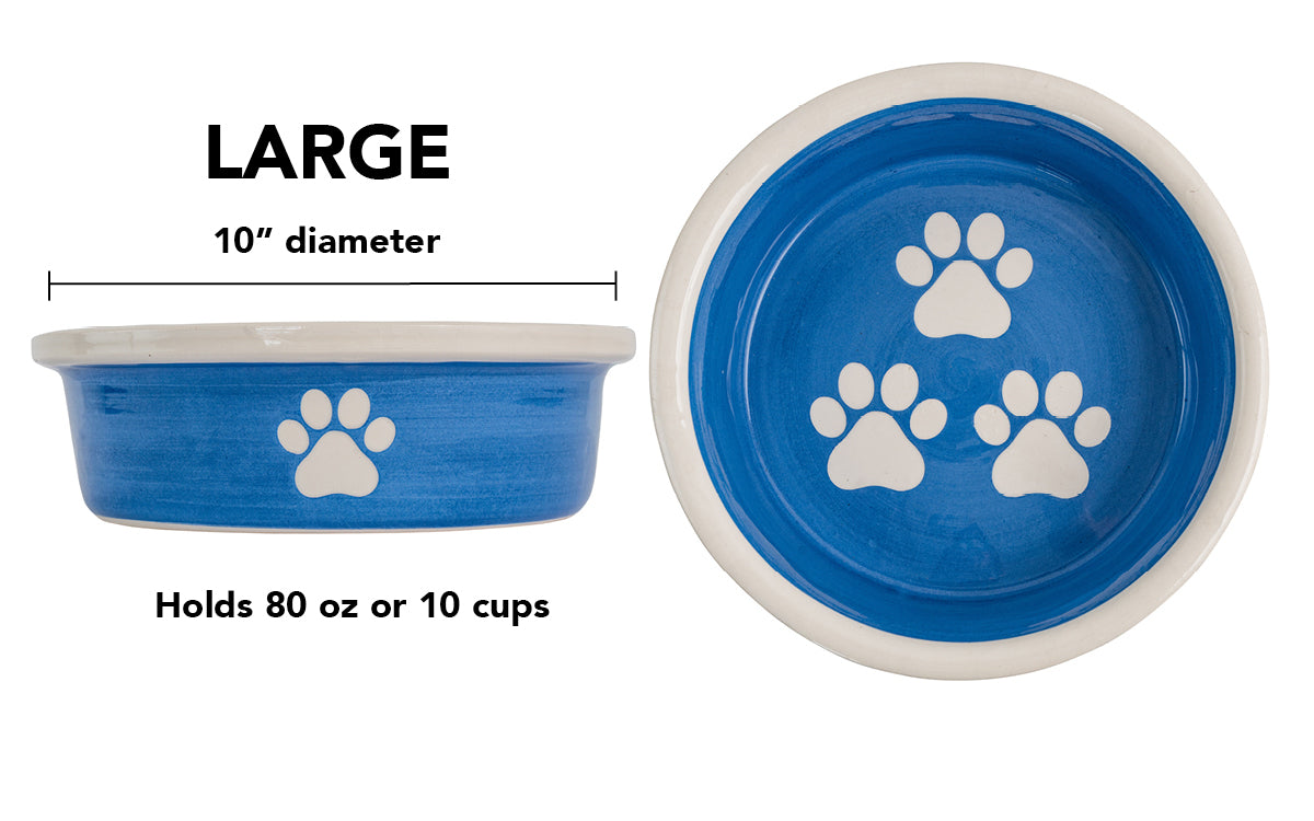 Large blue handmade ceramic dog bowl with white paw prints, 10-inch diameter and 10-cup (80-ounce) capacity.