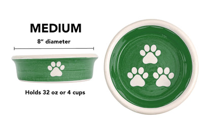 Medium green handmade ceramic dog bowl with white paw prints, 8-inch diameter and 4-cup (32-ounce) capacity.