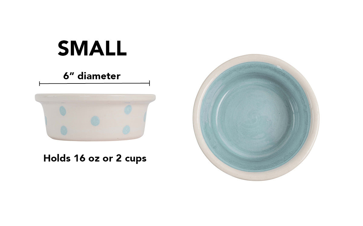 Small white handmade ceramic dog and cat bowl with large sky blue hand-painted dots and a solid sky blue interior, 6-inch diameter and 2-cup (16-ounce) capacity.