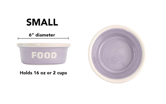 Small lavender handmade ceramic dog and cat food bowl with bold white FOOD lettering, lavender glazed interior and white rim, 6-inch diameter and 2-cup (16-ounce) capacity.
