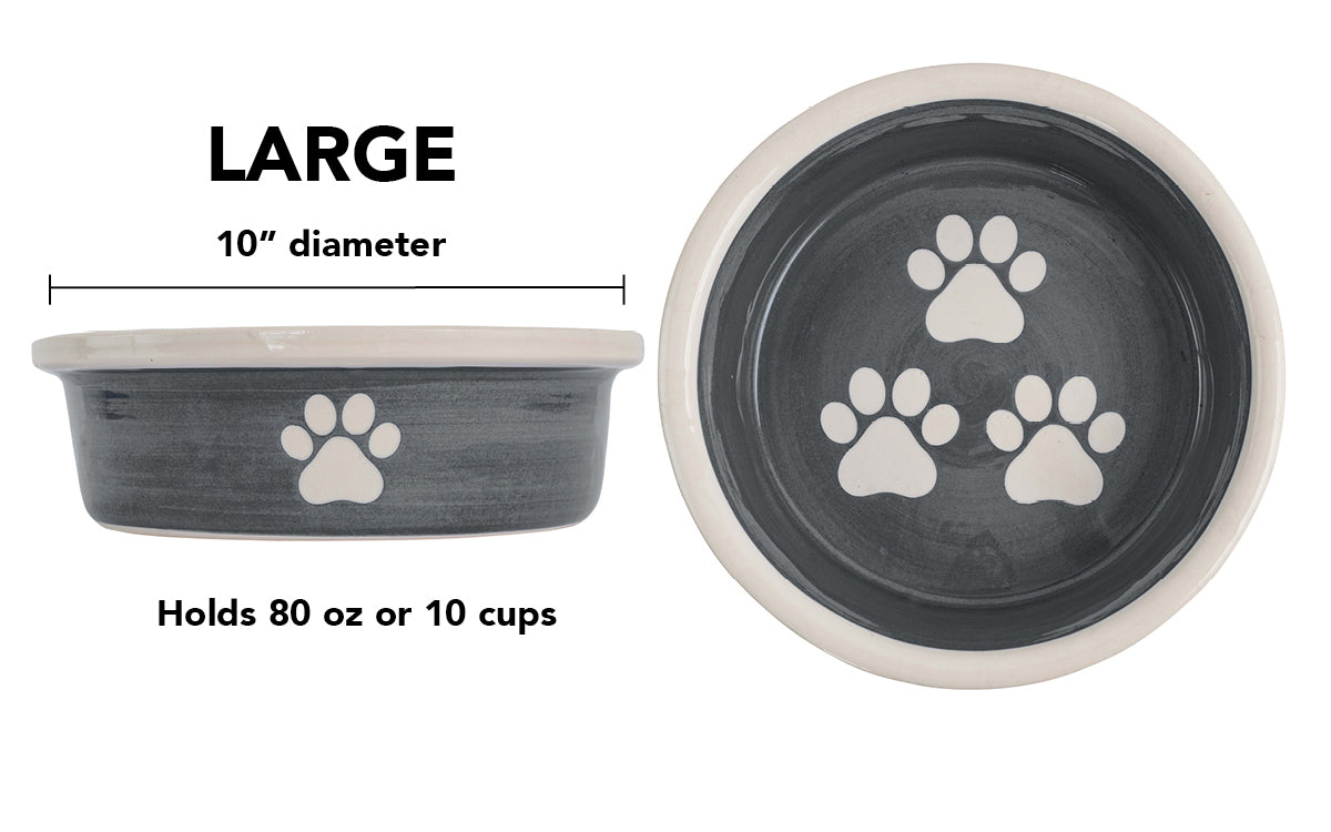 Large charcoal gray handmade ceramic dog bowl with white paw prints, 10-inch diameter and 10-cup (80-ounce) capacity.