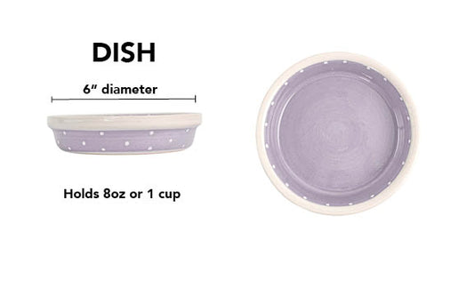 Lavender handmade ceramic pet dish with solid lavender glaze, crisp white polka dots around the exterior, coordinating white dotted detail around the inside rim and white rim, 6-inch diameter and 1-cup (8-ounce) capacity.