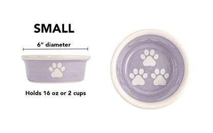 Small lavender handmade ceramic dog bowl with white paw prints, 6-inch diameter and 2-cup (16-ounce) capacity.