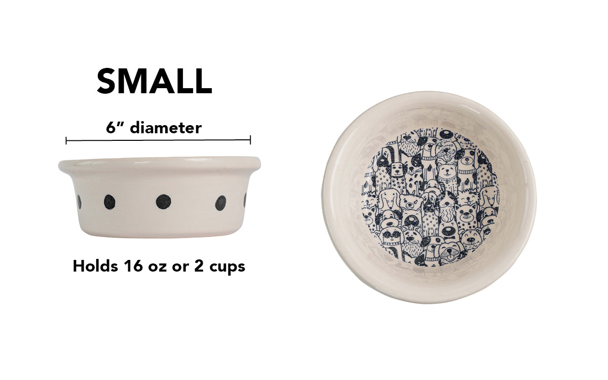 Small white handmade ceramic dog bowl with black polka dots around the outside and detailed black dog crowd illustration inside, 6-inch diameter and 2-cup (16-ounce) capacity.