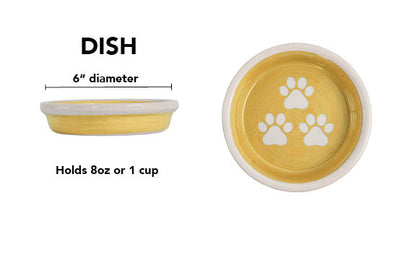 Yellow handmade ceramic pet dish with white paw prints, 6-inch diameter and 1-cup (8-ounce) capacity.