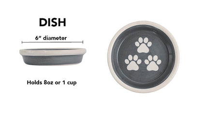 Charcoal gray handmade ceramic pet dish with white paw prints, 6-inch diameter and 1-cup (8-ounce) capacity.